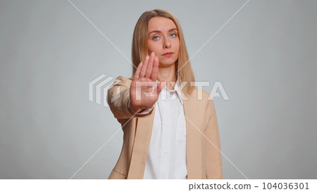 Woman say No hold palm folded crossed hands in stop gesture, warning of finish prohibited access Woman say No hold palm folded crossed hands in stop gesture, warning of finish prohibited access 104036301