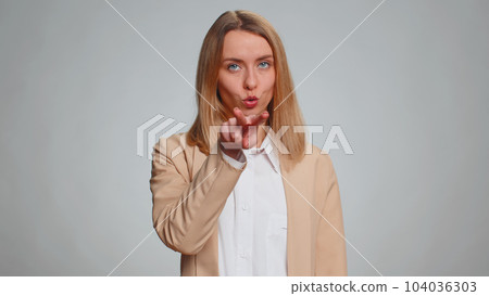 Business woman pointing at her eyes and camera, show I am watching you gesture, spying on someone 104036303