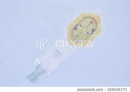 One piece ostomy bag with soft tap on blue background One piece ostomy bag with soft tap on blue background 104036373