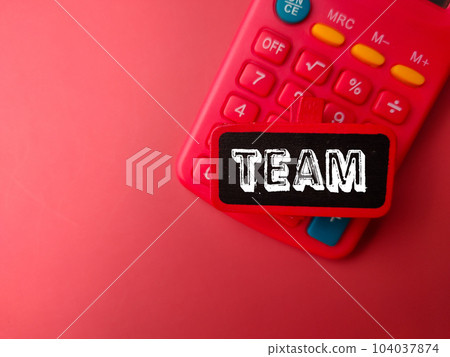 Calculator and wooden board with word TEAM Calculator and wooden board with word TEAM 104037874