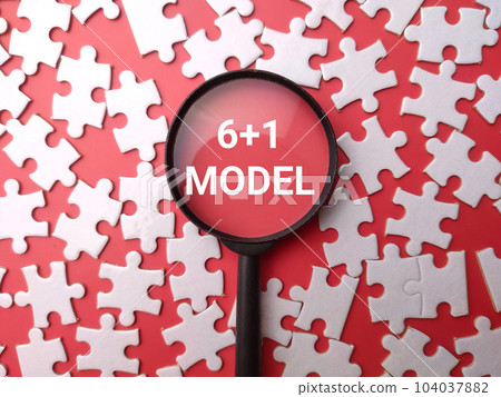 Magnifying glass and white puzzle with the word 6 plus 1 Model on a red background. Copywriting formula concept. Magnifying glass and white puzzle with the word 6 plus 1 Model on a red background. Copywriting formula concept. 104037882