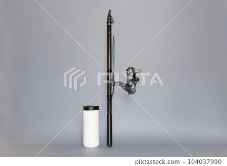 Design Fishing Spinning Rod, Reel, Thermo Travel Mug on Gray Background. Hobby, Leisure. Mockup, Copy Space for Text. Horizontal Plane Design Fishing Spinning Rod, Reel, Thermo Travel Mug on Gray Background. Hobby, Leisure. Mockup, Copy Space for Text. Horizontal Plane 104037990