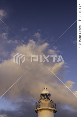 Lighthouse at dusk 104040357