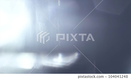Strong light coming in from the left side of a dark gray background Strong light coming in from the left side of a dark gray background 104041248