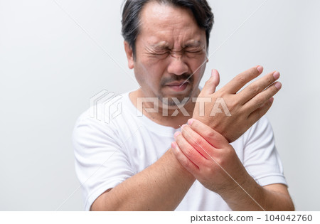Bearded man felt his wrist hurt and massaging sore zone isolated on white background 104042760