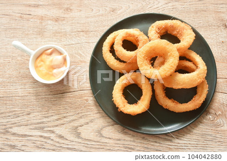 fried onion ring with flour dipping cheese and mayonnaise sauce  104042880