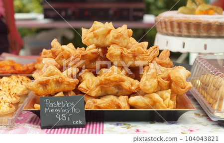 Pastellitos membrillo, Argentinian deep-fried crispy pastries at street food market. Pastellitos membrillo, Argentinian deep-fried crispy pastries at street food market. 104043821