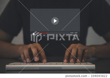 Man streaming live content online on virtual screen using keyboard, watching concerts, show, tutorials, and videos in real time. concept of online entertainment and distance learning digital age. 104043822