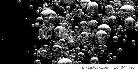 Soda water bubbles splashing underwater against black background. Cola liquid texture that fizzing and floating up to surface like a explosion in under water for refreshing carbonate drink concept. Soda water bubbles splashing underwater against black background. Cola liquid texture that fizzing and floating up to surface like a explosion in under water for refreshing carbonate drink concept. 104044486