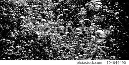 Soda water bubbles splashing underwater against black background. Cola liquid texture that fizzing and floating up to surface like a explosion in under water for refreshing carbonate drink concept. Soda water bubbles splashing underwater against black background. Cola liquid texture that fizzing and floating up to surface like a explosion in under water for refreshing carbonate drink concept. 104044490