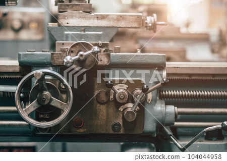Old Precision CNC Lathe Machine Rotor Milling in Heavy Metal Factory. 104044958