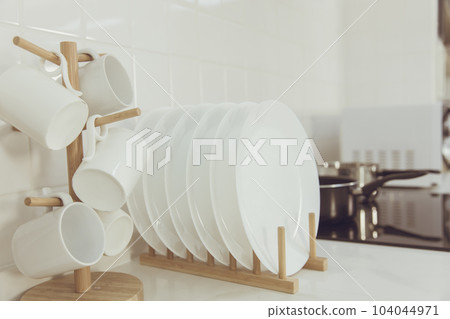 Kitchenware ceramic dishware managed row of clean new dish and cups Kitchen. 104044971