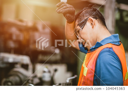 Tired fatigue exhausted engineer feel sick worker from hard working in factory sweat hot bad airflow workplace. Tired fatigue exhausted engineer feel sick worker from hard working in factory sweat hot bad airflow workplace. 104045363