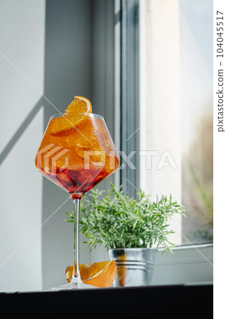 Glass of Aperol spritz cocktail 104045517