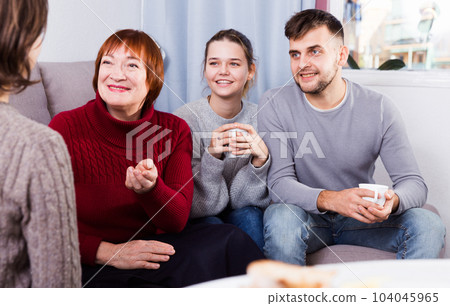 Family lively talking with female Family lively talking with female 104045965