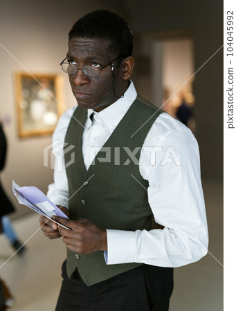 Afro man visiting exposition 104045992