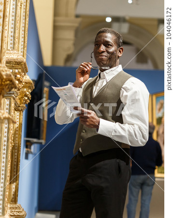 Mature afro man visiting Art Museum Mature afro man visiting Art Museum 104046172