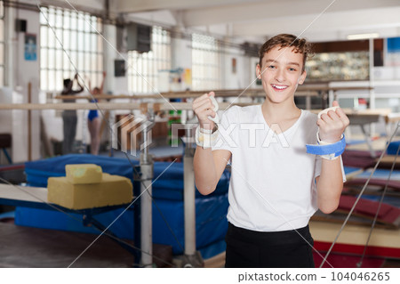 Happy teenage boy in gym Happy teenage boy in gym 104046265