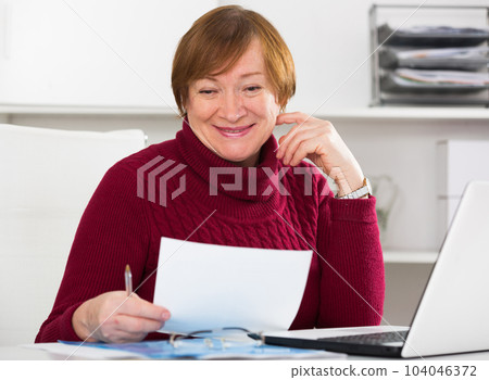 Woman working productively Woman working productively 104046372