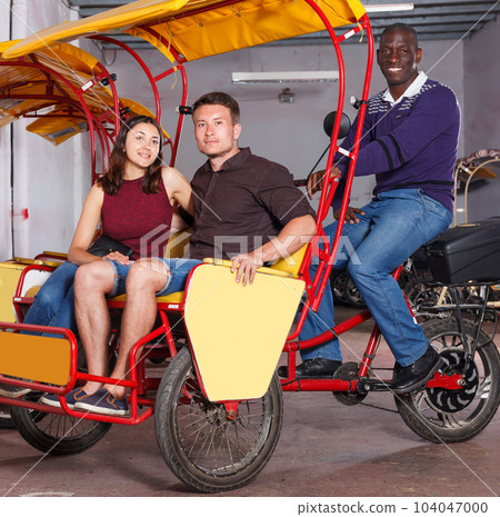 Ordinary couple planning to hire velotaxi Ordinary couple planning to hire velotaxi 104047000