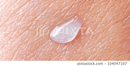 Collagen And Hyaluron Serum Gel On Skin. Splashing of Hyaluron gel. Liquid hyaluronic acid gel on skin. Cosmetic water gel texture on human skin background. Textured background. skin care product. Collagen And Hyaluron Serum Gel On Skin. Splashing of Hyaluron gel. Liquid hyaluronic acid gel on skin. Cosmetic water gel texture on human skin background. Textured background. skin care product. 104047107