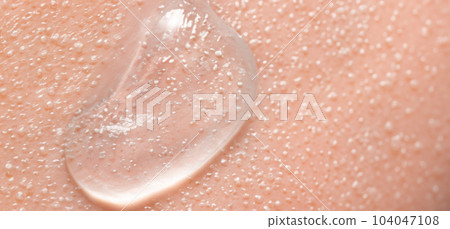 Collagen And Hyaluron Serum Gel On Skin. Splashing of Hyaluron gel. Liquid hyaluronic acid gel on skin. Cosmetic water gel texture on human skin background. Textured background. skin care product. Collagen And Hyaluron Serum Gel On Skin. Splashing of Hyaluron gel. Liquid hyaluronic acid gel on skin. Cosmetic water gel texture on human skin background. Textured background. skin care product. 104047108