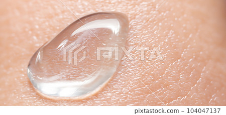 Collagen And Hyaluron Serum Gel On Skin. Splashing of Hyaluron gel. Liquid hyaluronic acid gel on skin. Cosmetic water gel texture on human skin background. Textured background. skin care product. Collagen And Hyaluron Serum Gel On Skin. Splashing of Hyaluron gel. Liquid hyaluronic acid gel on skin. Cosmetic water gel texture on human skin background. Textured background. skin care product. 104047137