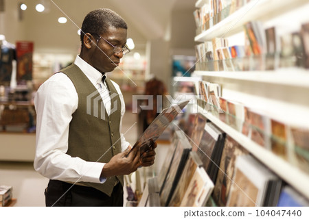 Man looking at souvenir products 104047440