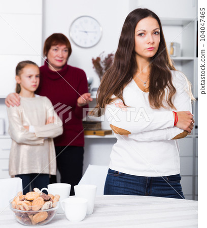 Upset woman after quarrel with family 104047465