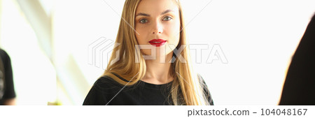 Portrait of beautiful young woman hairdresser with comb Portrait of beautiful young woman hairdresser with comb 104048167