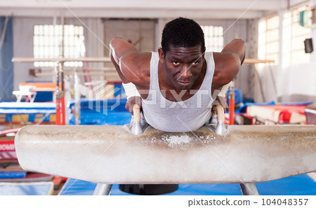 Man in sportswear doing exercises Man in sportswear doing exercises 104048357