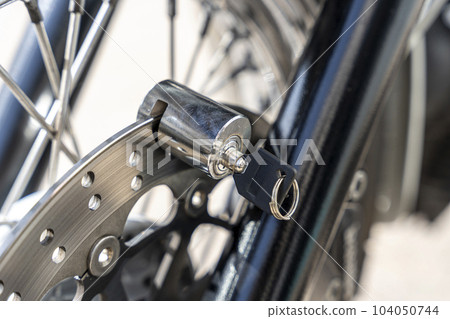 Anti-theft locking device on the motorcycle brake disc Anti-theft locking device on the motorcycle brake disc 104050744