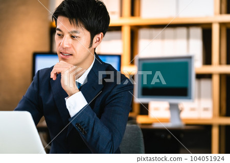 Businessman doing personal computer work 104051924