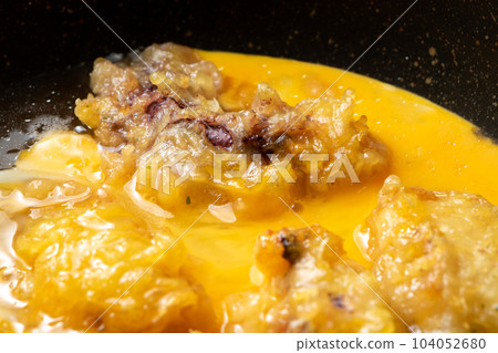 Tempura (octopus) egg binding cooking scene. Remake image of fried leftovers. 104052680