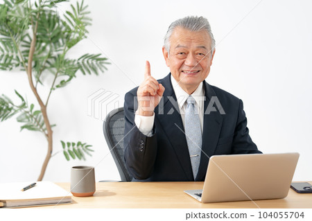 Business man pointing 104055704