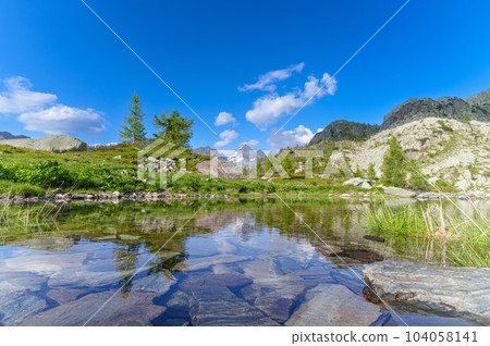 Alpine landscape of the Brembana Valley with small lake and Pizzo del Diavolo Alpine landscape of the Brembana Valley with small lake and Pizzo del Diavolo 104058141