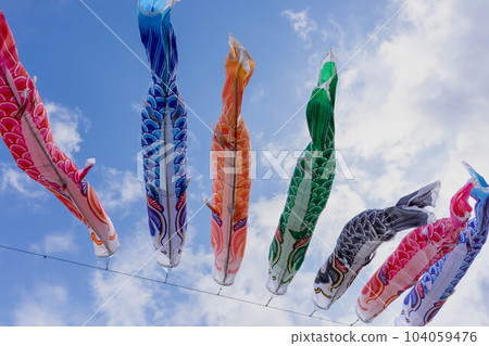 Colorful carp streamers blowing in the blue sky of May Colorful carp streamers blowing in the blue sky of May 104059476