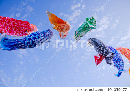 Colorful carp streamers blowing in the blue sky of May Colorful carp streamers blowing in the blue sky of May 104059477