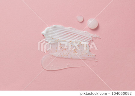 Many cosmetic products samples with vitamin C - cream and gel smears. Aesthetic beautiful textured smear transparent on light background Many cosmetic products samples with vitamin C - cream and gel smears. Aesthetic beautiful textured smear transparent on light background 104060092
