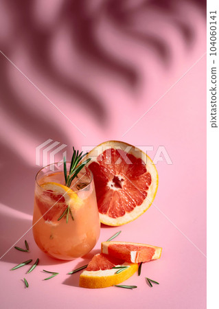 Summer cocktail with grapefruit, rosemary, and ice. Summer cocktail with grapefruit, rosemary, and ice. 104060141