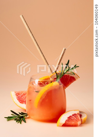 Cocktail with grapefruit, rosemary, and ice. Cocktail with grapefruit, rosemary, and ice. 104060149