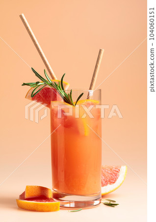 Summer cocktail with grapefruit, rosemary, and ice. 104060151