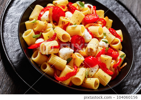 pepper tomato mozzarella pasta salad in bowl pepper tomato mozzarella pasta salad in bowl 104060156