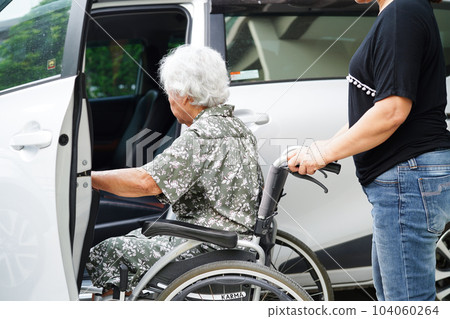 Caregiver help Asian elderly woman disability patient get in her car, medical concept. Caregiver help Asian elderly woman disability patient get in her car, medical concept. 104060264