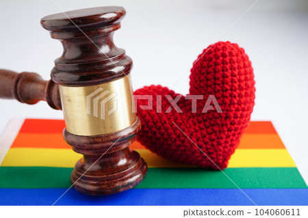 Gavel for judge lawyer with heart rainbow flag, symbol of LGBT pride month. 104060611