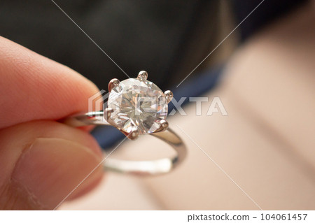 hand hold beautiful jewelry diamond ring hand hold beautiful jewelry diamond ring 104061457