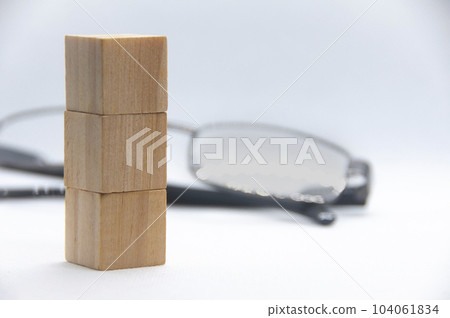 Wooden cube stacked on white cover background with customizable space for text. Copy space Wooden cube stacked on white cover background with customizable space for text. Copy space 104061834