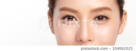 close up of beauty asian woman eye on white background. 104062025