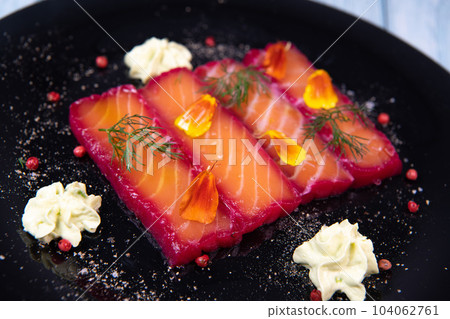 Recipe for gravlax salmon marinated with beet and avocado mayonnaise sauce 104062761