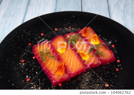 Recipe for gravlax salmon marinated with beet and avocado mayonnaise sauce 104062762